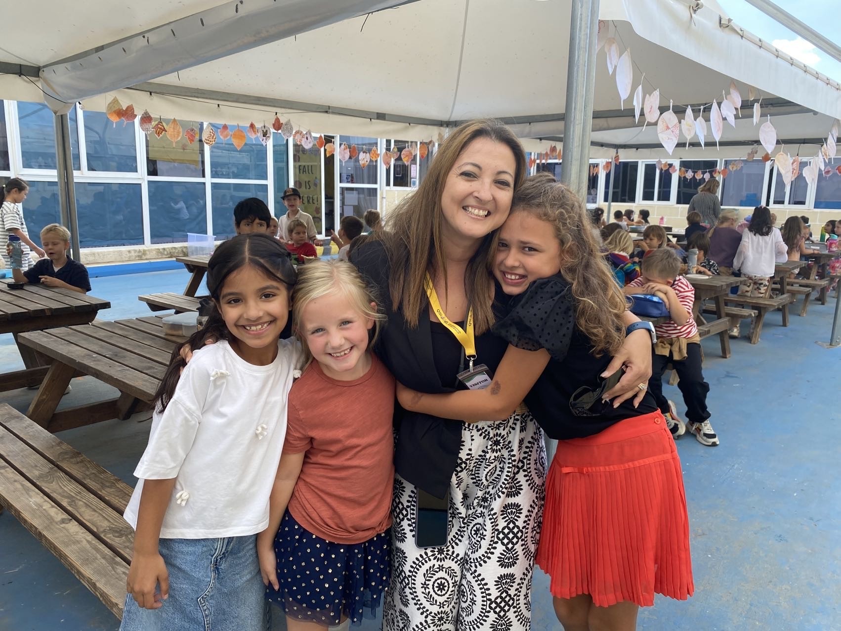 Dr. Becker sharing a smile with some students.